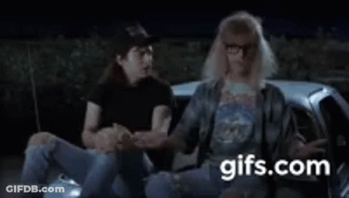 A Man And A Woman Are Sitting In A Car . GIF