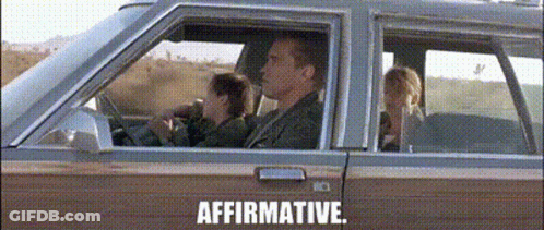 A Man And A Woman Are Sitting In A Car With The Words Affirmative Written On The Bottom GIF