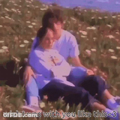 A Man And A Woman Are Sitting In A Field With The Words Wish I Was With You Like This 3 GIF