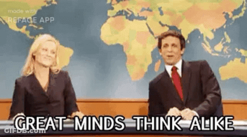 A Man And A Woman Are Sitting In Front Of A Map Of The World On A Television Show . GIF