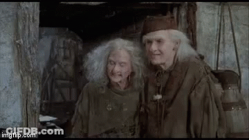 A Man And A Woman Are Sitting Next To Each Other And Saying `` Bye Bye ! '' GIF