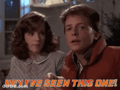 A Man And A Woman Are Sitting Next To Each Other And The Man Says Hey I 'Ve Seen This One ! GIF