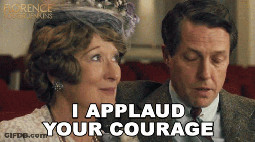 Man And Woman Sitting, Man Says I Applaud Your Courage GIF