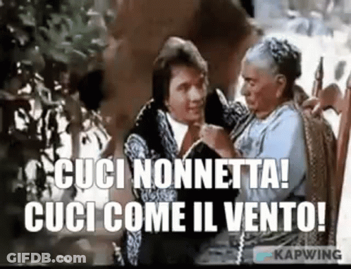 A Man And A Woman Are Sitting Next To Each Other And The Woman Is Holding The Man 'S Hand . GIF