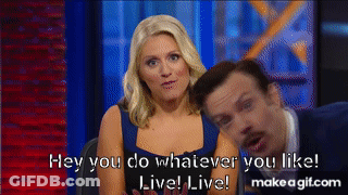 A Man And A Woman Are Sitting Next To Each Other And The Woman Is Saying Hey You Do Whatever You Like GIF
