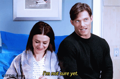 Man And Woman Sitting Next To Each Other Woman Says I'm Not Sure Yet GIF