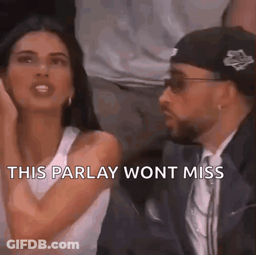A Man And A Woman Are Sitting Next To Each Other And The Woman Is Saying This Parlay Won 'T Miss . GIF