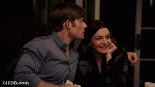 Man And Woman Sitting Together Woman Smiling GIF