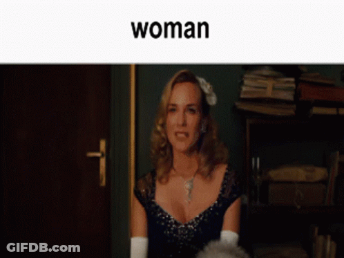 A Man And A Woman Are Sitting Next To Each Other And The Word Woman Is On The Bottom GIF