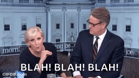 A Man And A Woman Are Sitting Next To Each Other In Front Of A White House And Talking . GIF
