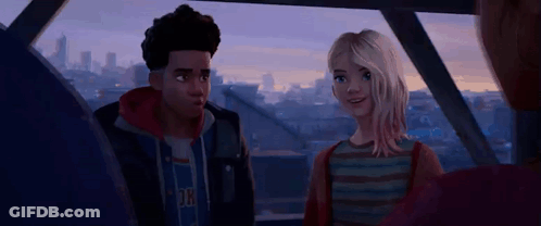 A Man And A Woman Are Sitting Next To Each Other On A Balcony . GIF