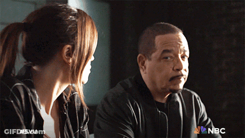 A Man And A Woman Are Sitting Next To Each Other With A Nbc Logo On The Bottom GIF