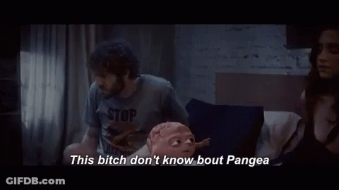 A Man And A Woman Are Sitting On A Bed And The Man Is Talking To The Woman . GIF