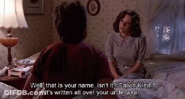 A Man And A Woman Are Sitting On A Bed And The Woman Says Well That Is Your Name Isn't It Calvin Klein GIF