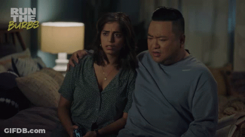 A Man And A Woman Are Sitting On A Bed With The Words Run The Burbs Above Them GIF