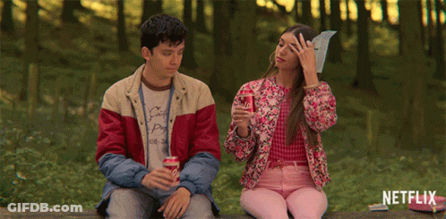 A Man And A Woman Are Sitting On A Bench With Netflix Written On The Bottom GIF