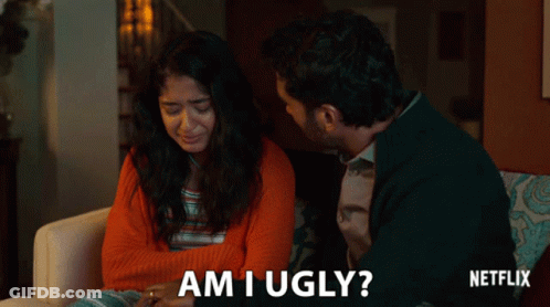 A Man And A Woman Are Sitting On A Couch And The Man Asks The Woman If She Is Ugly GIF