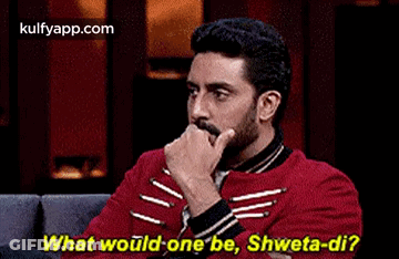 A Man And A Woman Are Sitting On A Couch And The Man Is Asking The Woman What Would One Be . GIF
