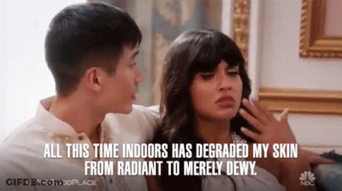 A Man And A Woman Are Sitting On A Couch And The Man Says All This Time Indoors Has Degraded My Skin From Radiant GIF