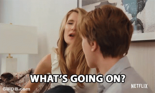 A Man And A Woman Are Sitting On A Couch And The Woman Says What 'S Going On GIF