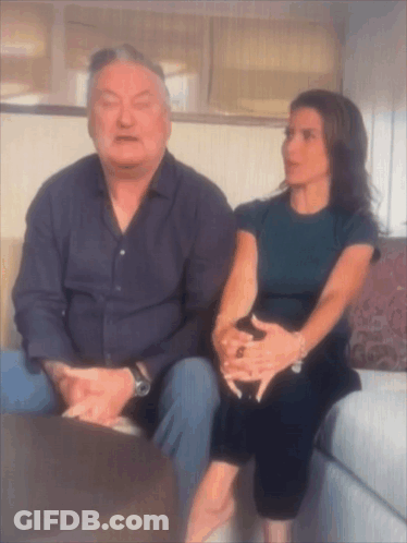 Man And Woman Sitting On Couch Talking GIF