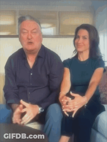 Man And Woman Sitting On Couch Talking GIF