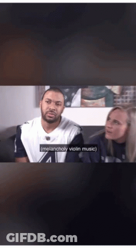 A Man And A Woman Are Sitting On A Couch With The Man Saying Melancholy Violin Music GIF