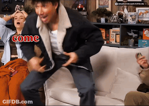 A Man And A Woman Are Sitting On A Couch With The Word Come On The Bottom GIF