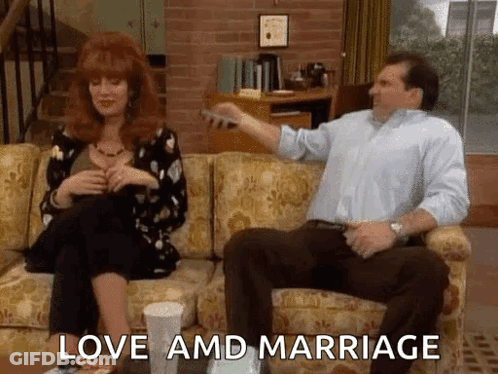 Man And Woman Sitting On Couch Love And Marriage GIF