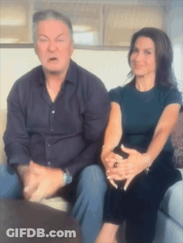 Man And Woman Sitting On Couch GIF