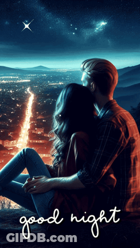 A Man And A Woman Are Sitting On A Hill Looking At A City At Night GIF