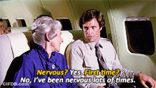 A Man And A Woman Are Sitting On A Plane And The Woman Is Saying Nervous Yes First Time GIF