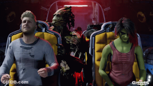 A Man And A Woman Are Sitting On A Roller Coaster With Guardians Of The Galaxy In The Background GIF
