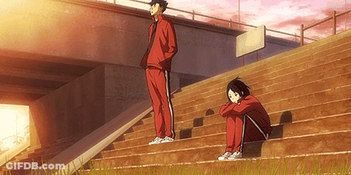 A Man And A Woman Are Sitting On Stairs Under A Bridge . GIF