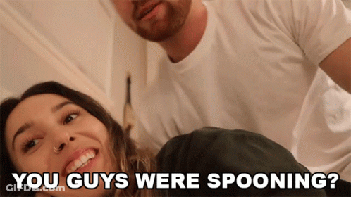 A Man And A Woman Are Smiling With The Words " You Guys Were Spooning " Below Them GIF