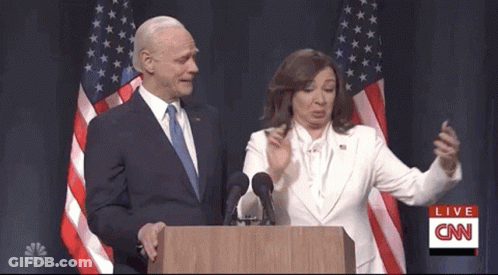 Man And Woman At Podium With CNN Behind GIF