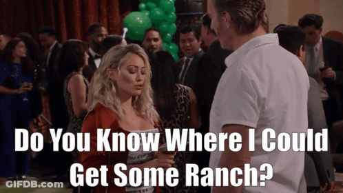 A Man And A Woman Are Standing In A Crowd And The Man Asks The Woman Where She Could Get Some Ranch GIF