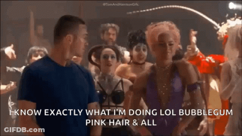 A Man And A Woman Are Standing In A Crowd And The Man Says I Know Exactly What I 'M Doing Lol GIF