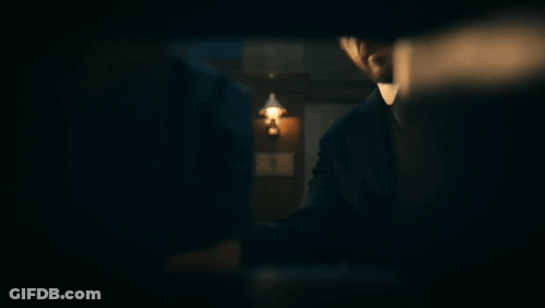 Man And Woman Standing In Dark Room With Nothing GIF