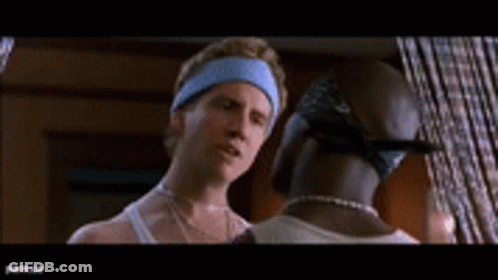 A Man And A Woman Are Standing In A Room Talking To Each Other GIF