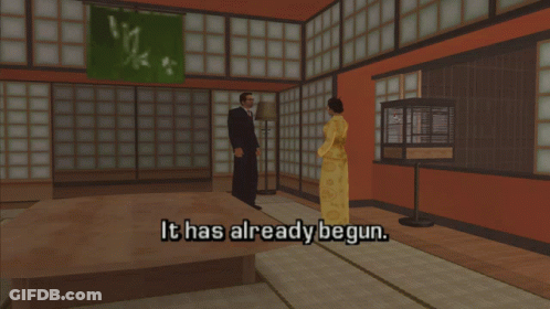 A Man And A Woman Are Standing In A Room With The Words It Has Already Begun GIF