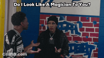 A Man And A Woman Are Standing In Front Of A Brick Wall With The Words " Do I Look Like A Magician To You " GIF