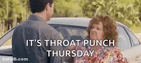 A Man And A Woman Are Standing In Front Of A Car And Talking . GIF