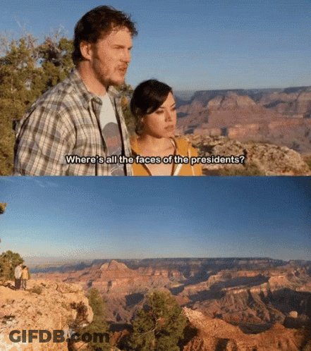 A Man And A Woman Are Standing In Front Of A Grand Canyon And Talking About Where All The Faces Of The Presidents GIF