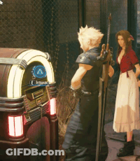 A Man And A Woman Are Standing In Front Of A Jukebox That Says " El Principe " On It GIF