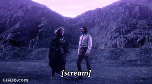 A Man And A Woman Are Standing In Front Of A Mountain And The Words Scream Are Written Below Them GIF