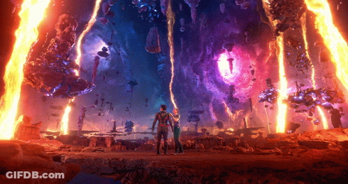 A Man And A Woman Are Standing In Front Of A Purple And Orange Fire GIF