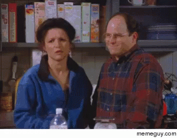 A Man And A Woman Are Standing In Front Of A Shelf Full Of Cereal Boxes .. GIF