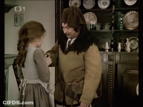 A Man And A Woman Are Standing In Front Of A Shelf With Plates On It And The Number 01 On The Bottom Right GIF