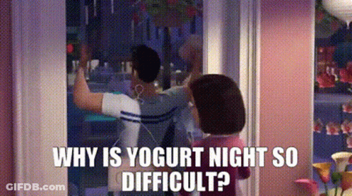 A Man And A Woman Are Standing In Front Of A Window . The Woman Is Asking The Man Why Is Yogurt Night So Difficult GIF